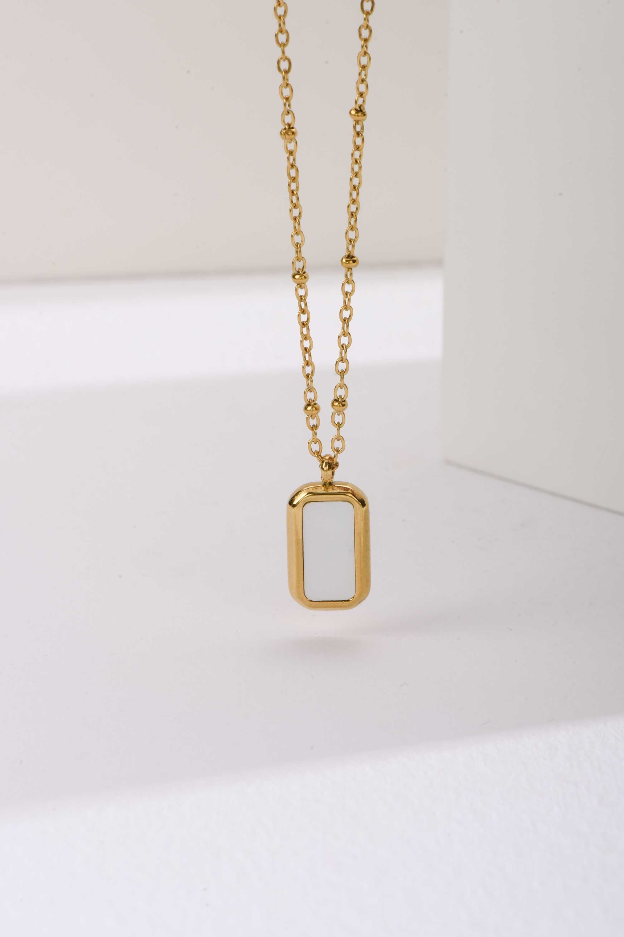Stainless Steel Necklace | Gold Beaded Chain with White Enamel Rectangle Pendant Accessories Accessories - Cizaro Jeans