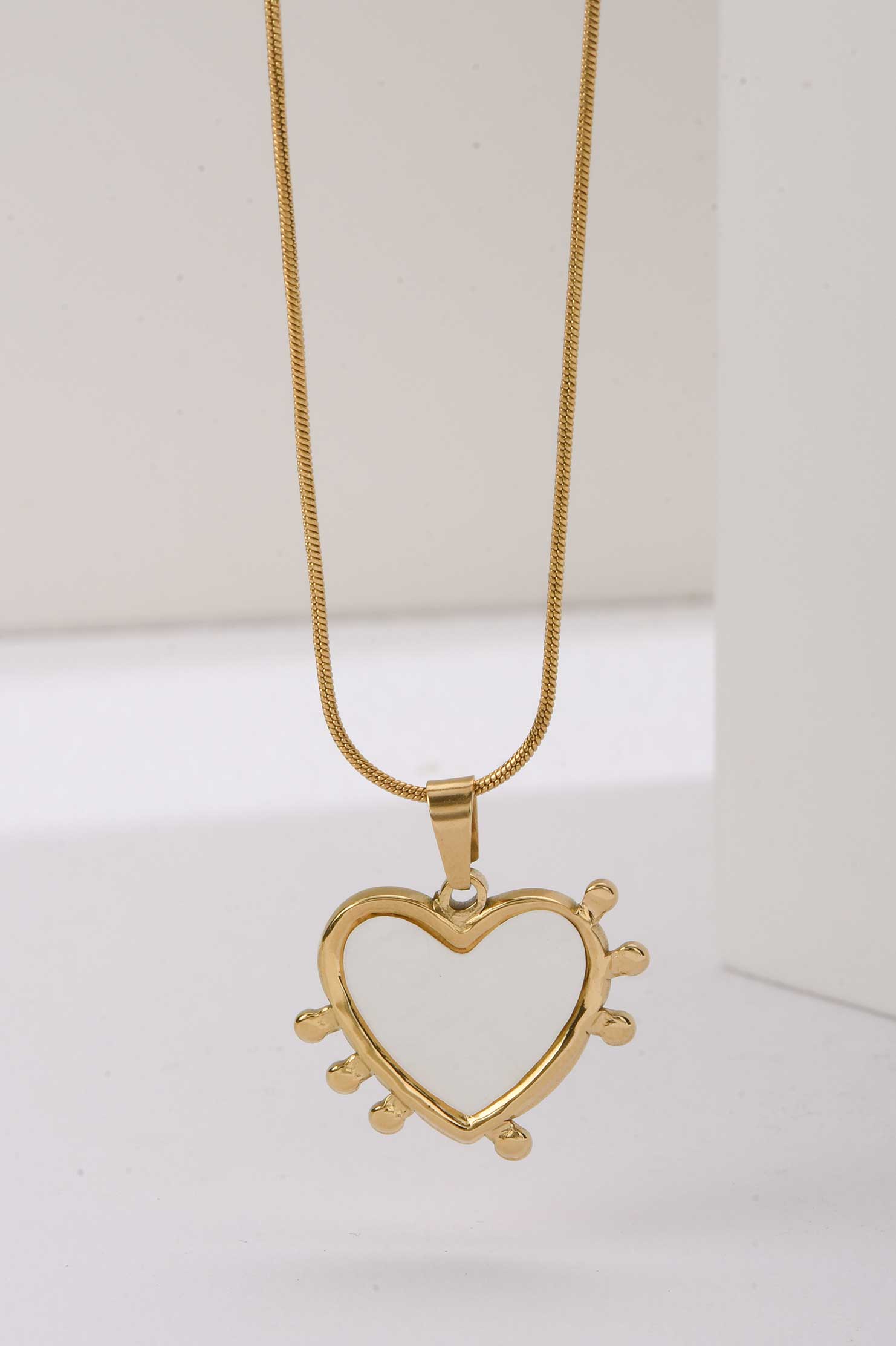 Stainless Steel Necklace | Heart-Shaped Gold Pendant with White Enamel & Radiant Spikes NECKLACE Accessories - Cizaro Jeans
